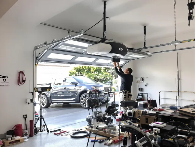 Aliso Viejo Garage Door Repair specialist installing smart garage door opener system in Aliso Viejo home